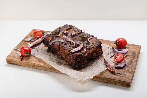 smoked beef on a chopping board