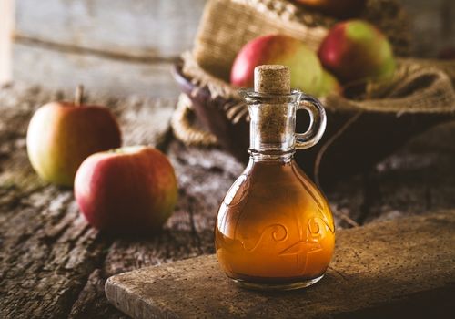 Apple Cider Vinegar with a Bunch of Apples