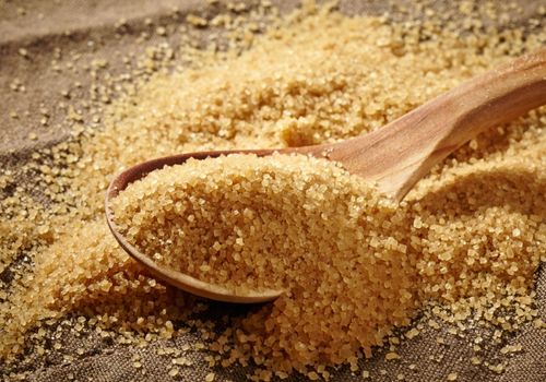 Brown Sugar Heap and Wooden Spoon