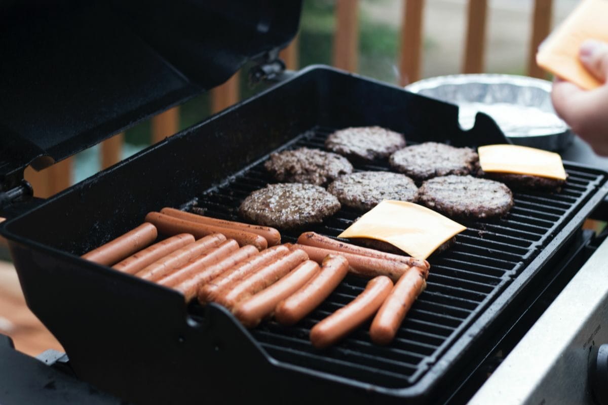 Sausages, Burger Patty and Cheese on the Grill