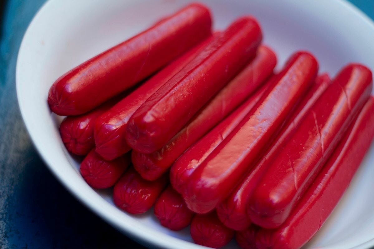 Bunch of Hot Dog Sausages in a White Bowl
