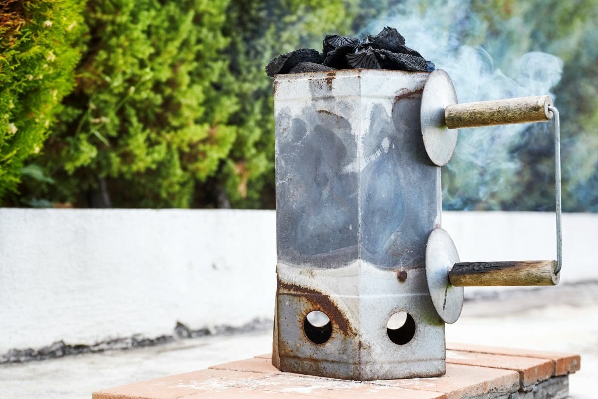 Smoking Charcoal Chimney Starter Bucket in the Backyard
