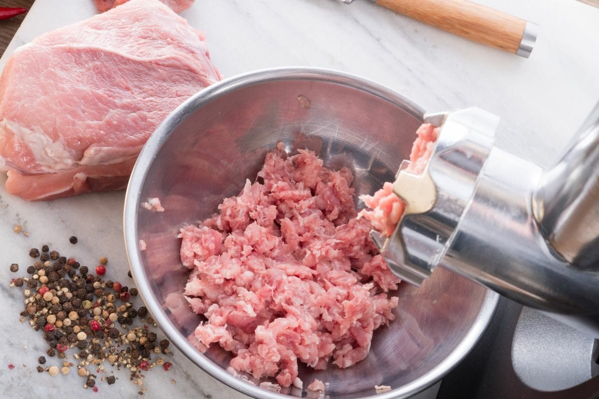 Ground Meat on a Dish with Spices and Whole Meat