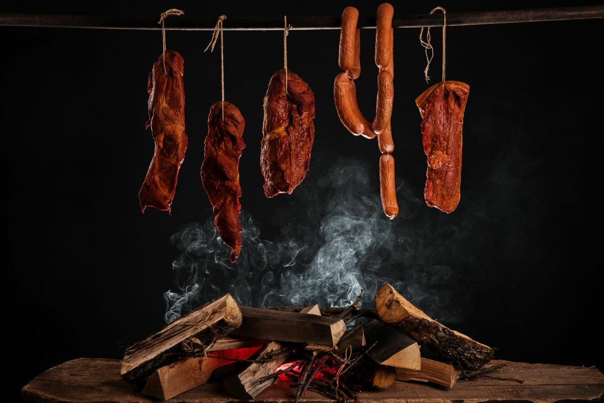 Smoked Ham, Bacon, Pork Neck and Sausages in a Smoke House