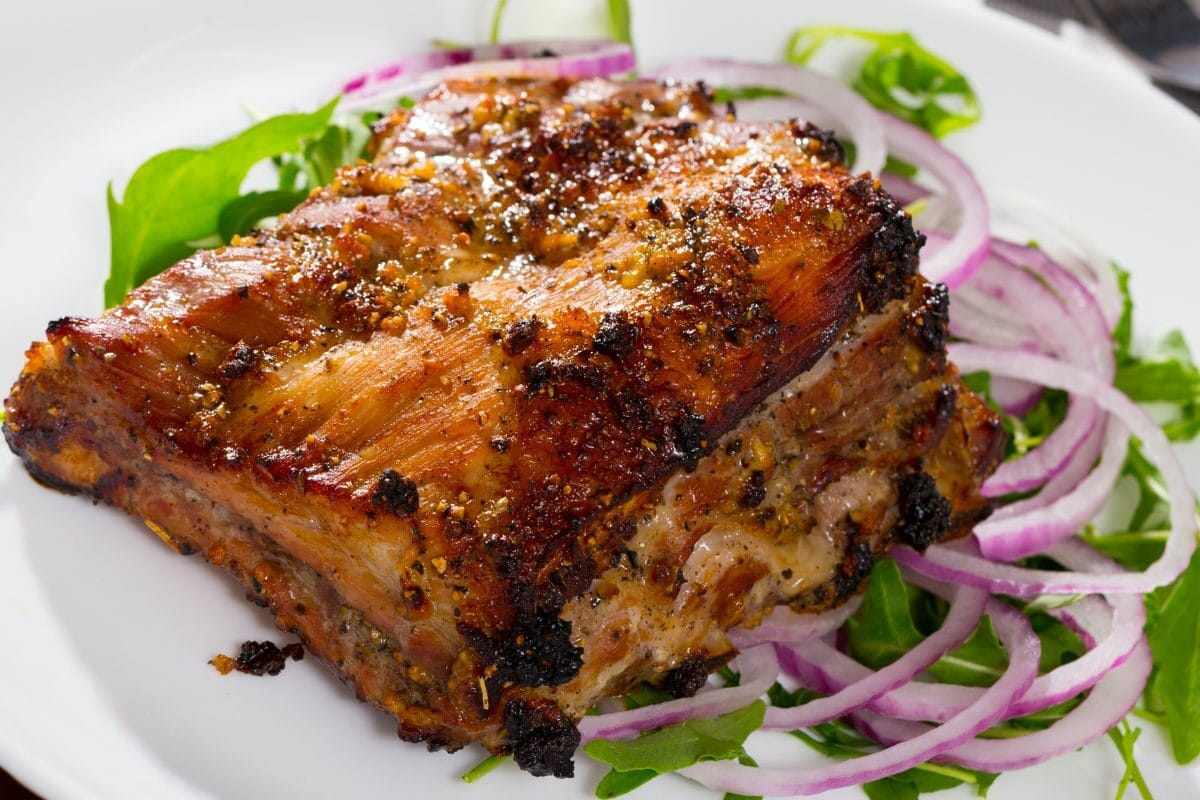 Roasted Pork Rack of Ribs with Onions and Greens