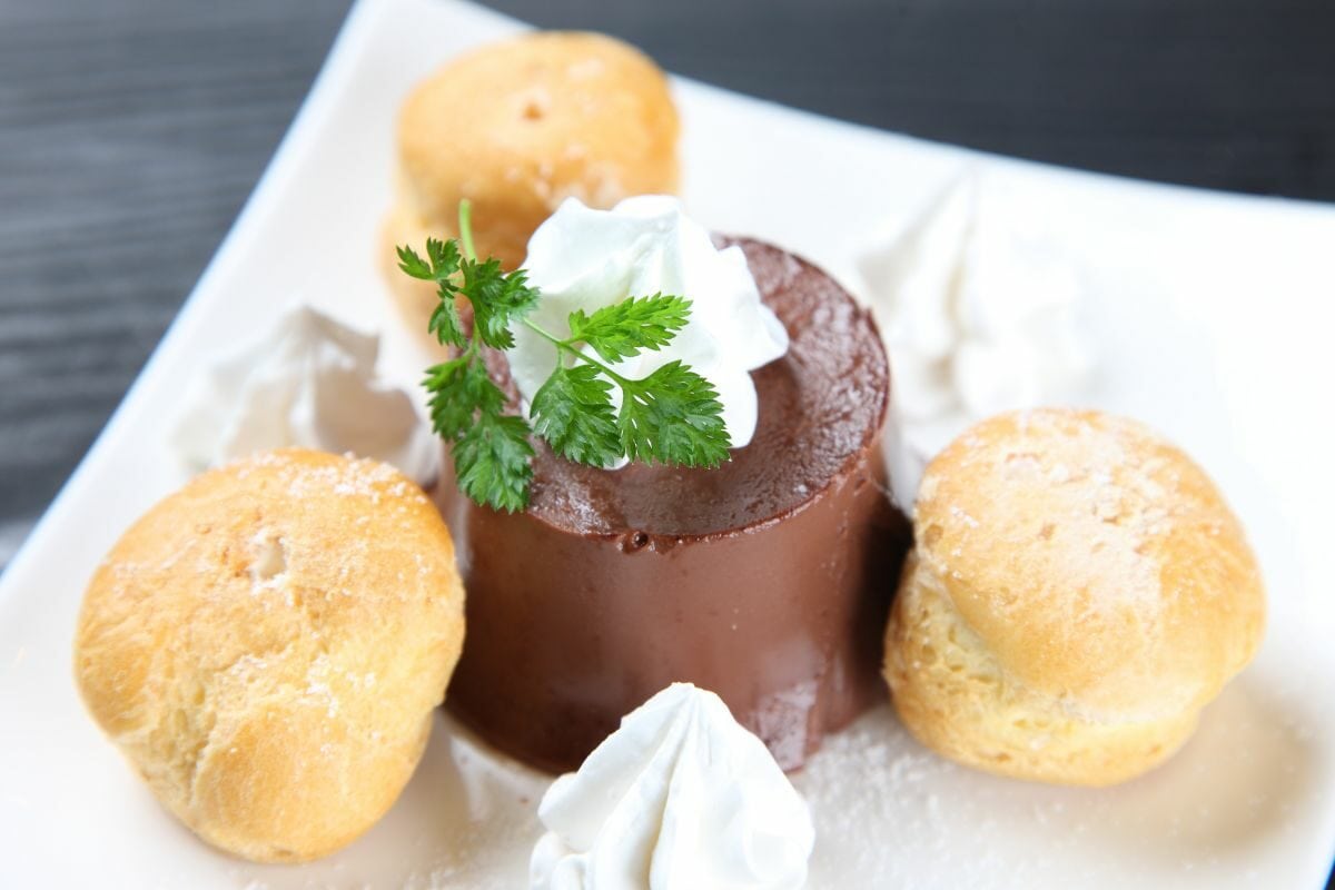 Chocolate Pudding Topped with Fresh Cream and Freshly Baked Cream Buns