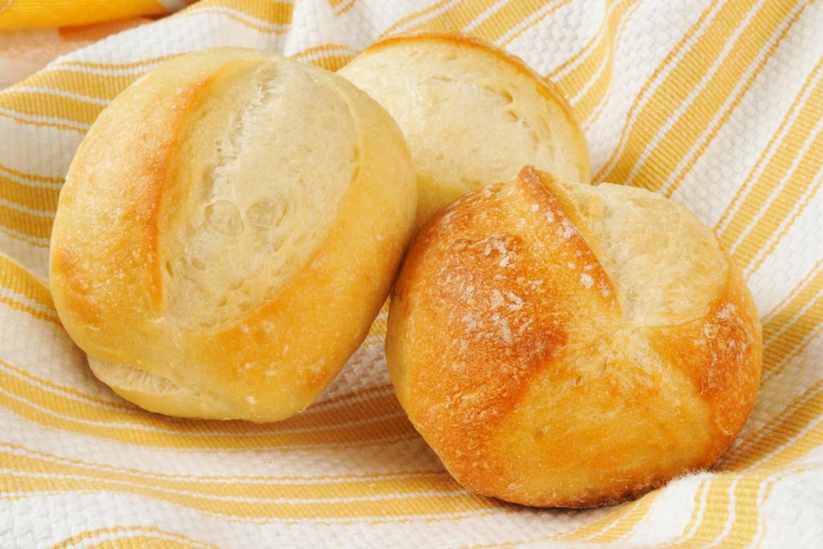 Basket of Dinner Rolls Wrapped in a Napkin