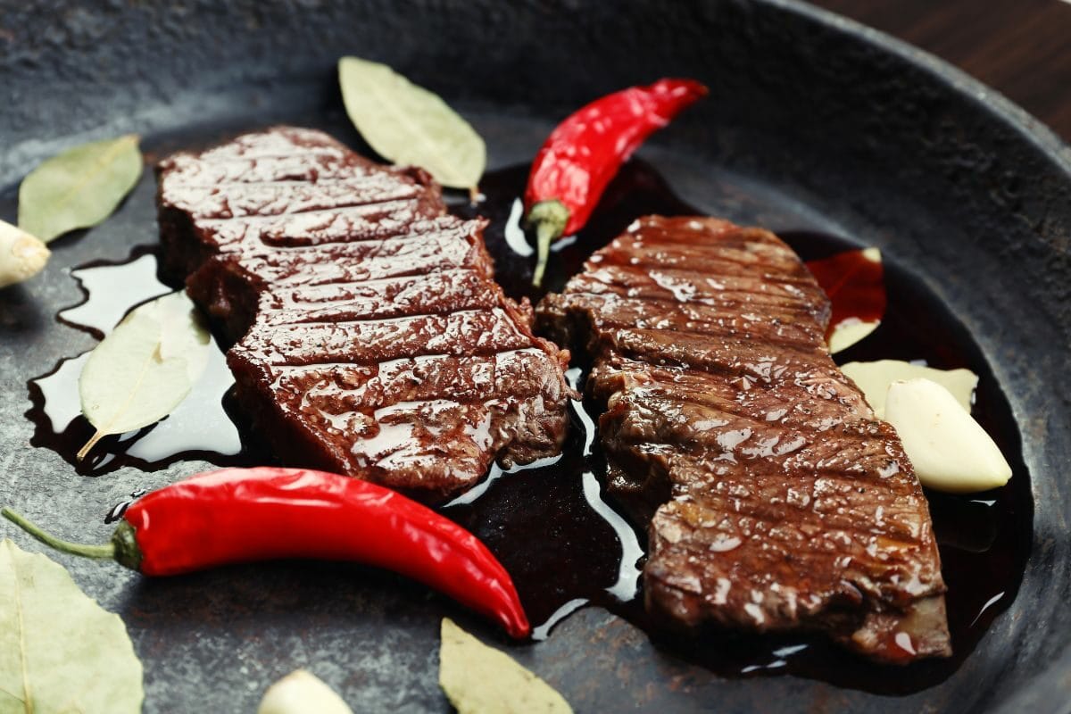 Pan Seared Steaks with Chili Peppers and Garlic